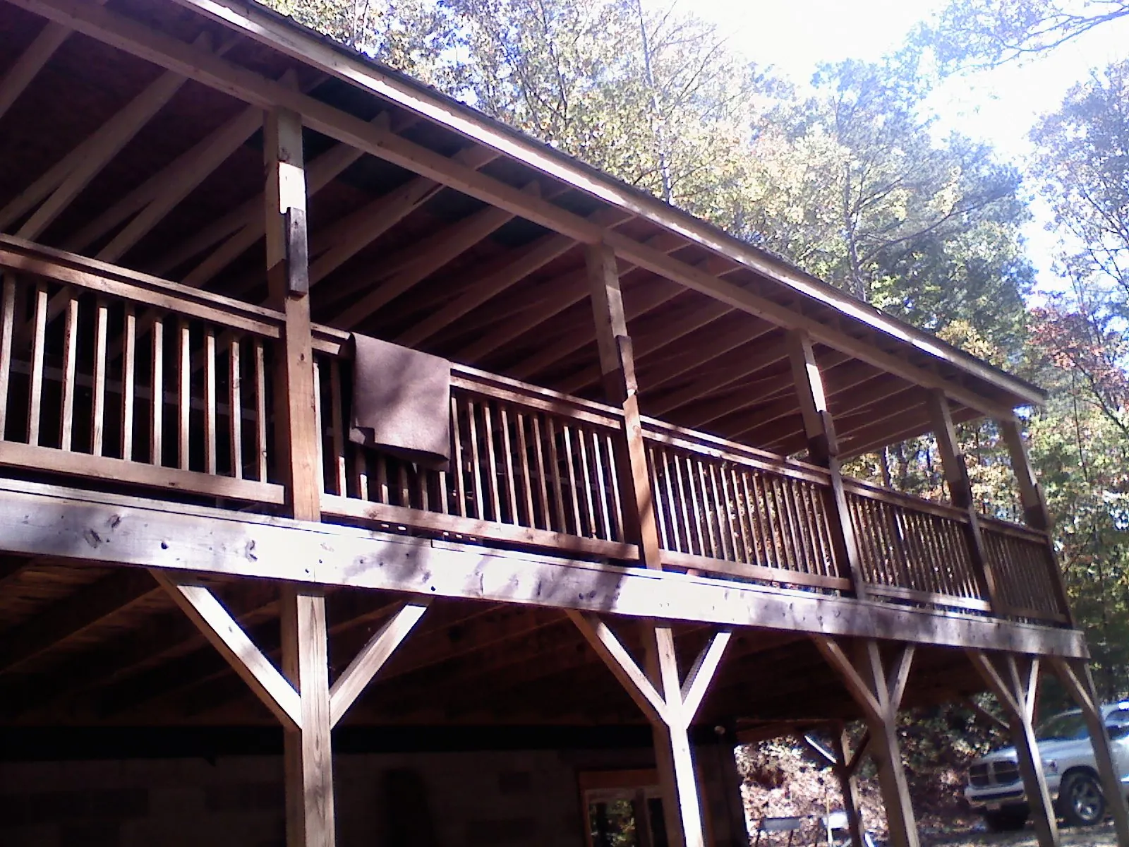 Timber framing under a new elevated porch and deck — Roof Leak Repair in Queen by Roofing Brothers